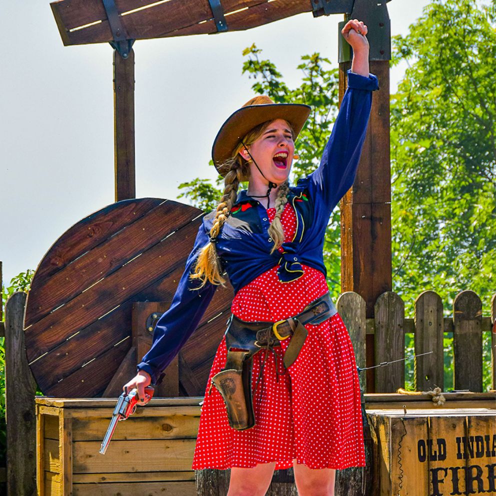 This cowgirl in a red summer dress means business